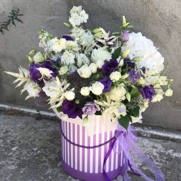 White and purple flowers in a box