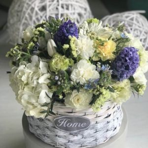 Hydrangea, tulips, hyacinths, carnations in a basket with the scent of spring.